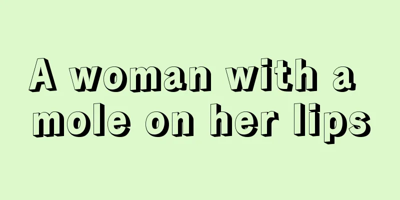 A woman with a mole on her lips