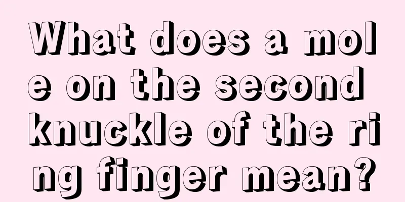 What does a mole on the second knuckle of the ring finger mean?