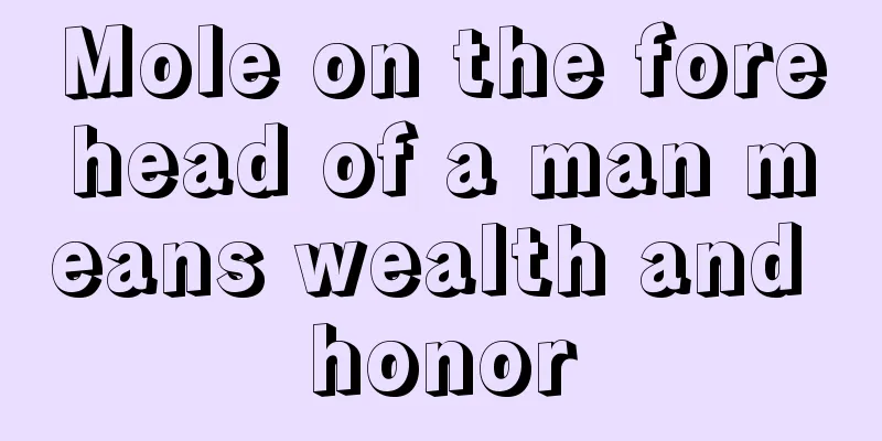 Mole on the forehead of a man means wealth and honor