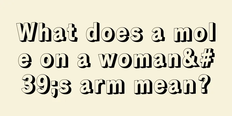 What does a mole on a woman's arm mean?