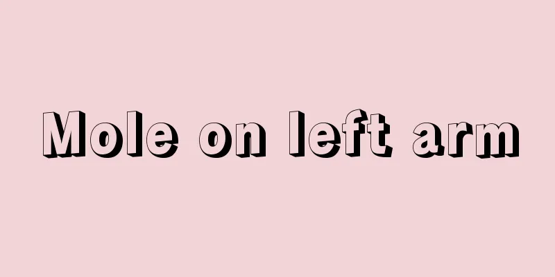 Mole on left arm