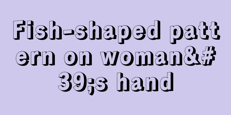 Fish-shaped pattern on woman's hand
