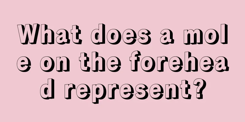 What does a mole on the forehead represent?