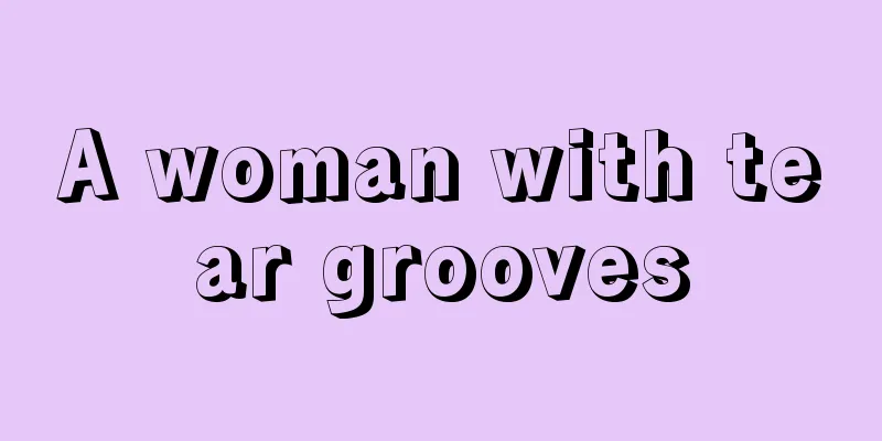 A woman with tear grooves