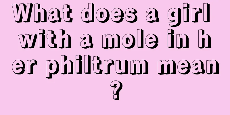 What does a girl with a mole in her philtrum mean?