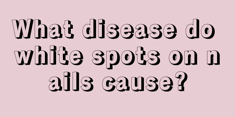 What disease do white spots on nails cause?