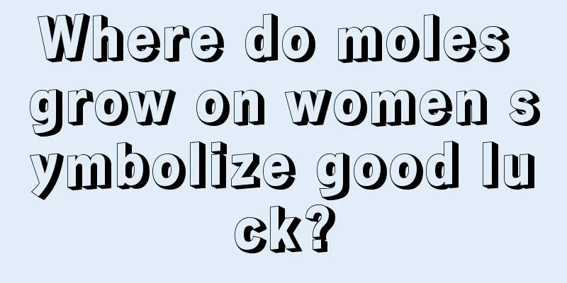 Where do moles grow on women symbolize good luck?