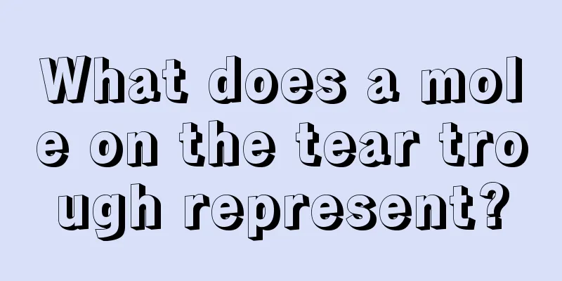 What does a mole on the tear trough represent?