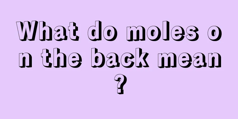 What do moles on the back mean?
