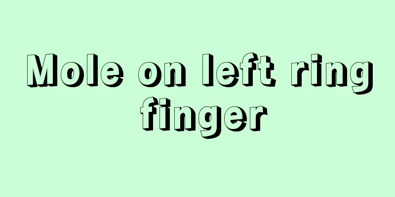 Mole on left ring finger