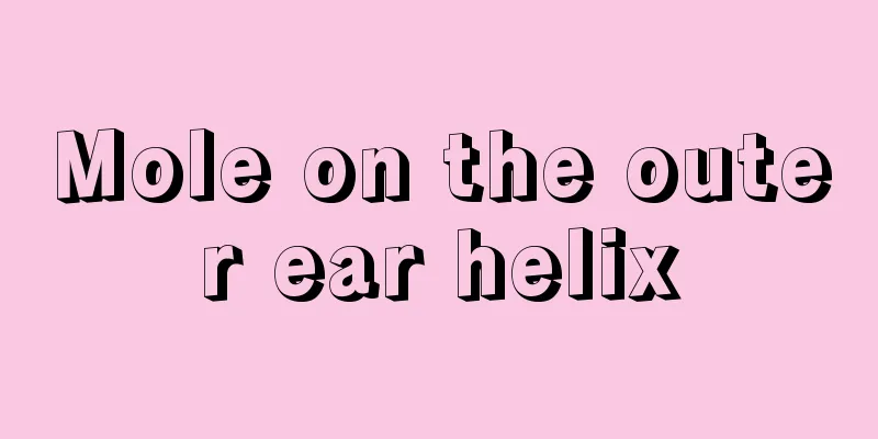 Mole on the outer ear helix