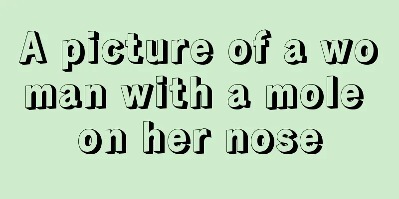 A picture of a woman with a mole on her nose