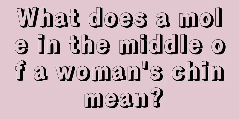 What does a mole in the middle of a woman's chin mean?