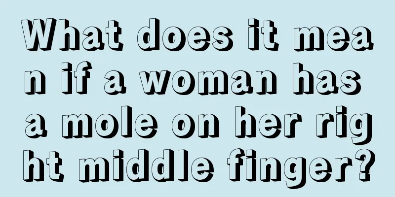 What does it mean if a woman has a mole on her right middle finger?