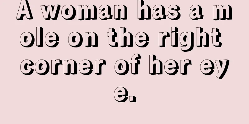 A woman has a mole on the right corner of her eye.