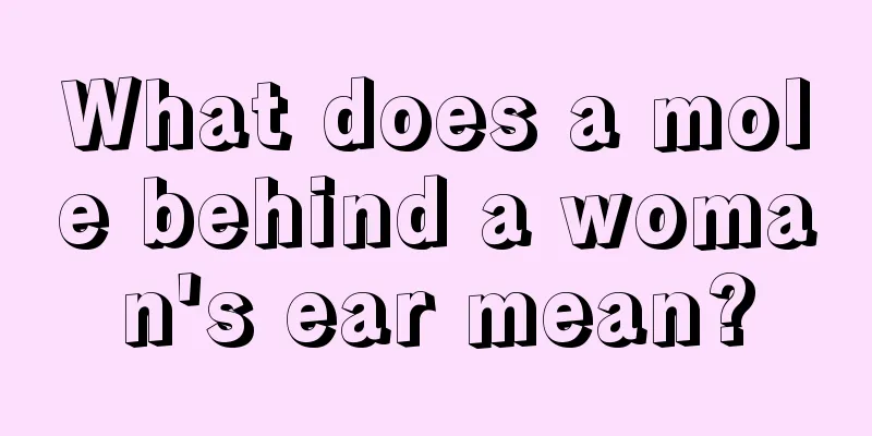 What does a mole behind a woman's ear mean?
