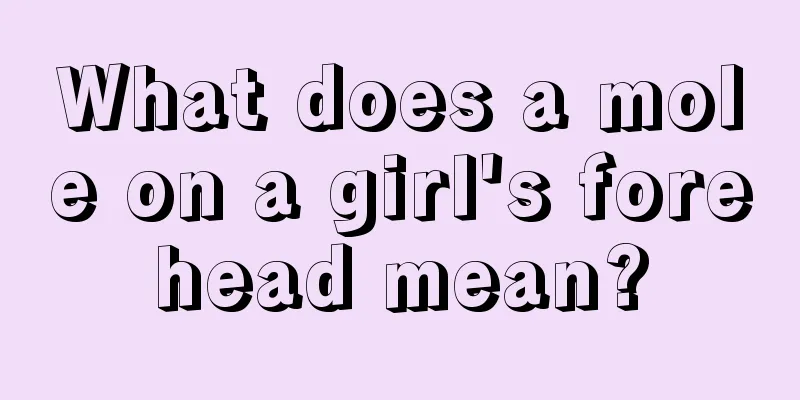 What does a mole on a girl's forehead mean?