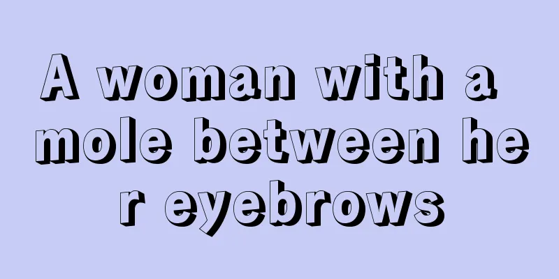 A woman with a mole between her eyebrows