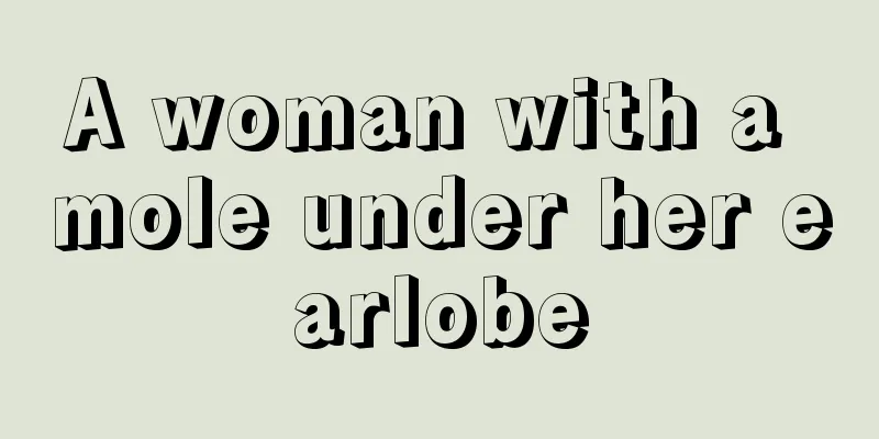 A woman with a mole under her earlobe