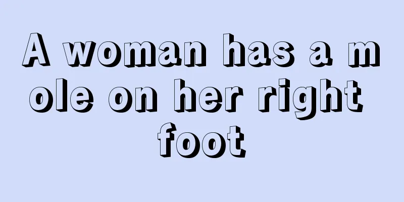 A woman has a mole on her right foot