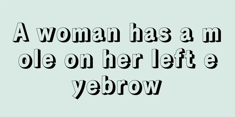 A woman has a mole on her left eyebrow