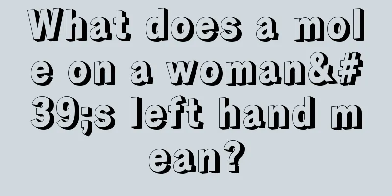 What does a mole on a woman's left hand mean?