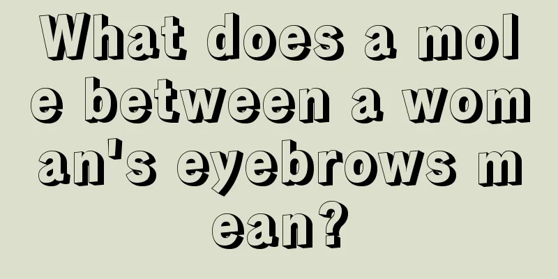 What does a mole between a woman's eyebrows mean?