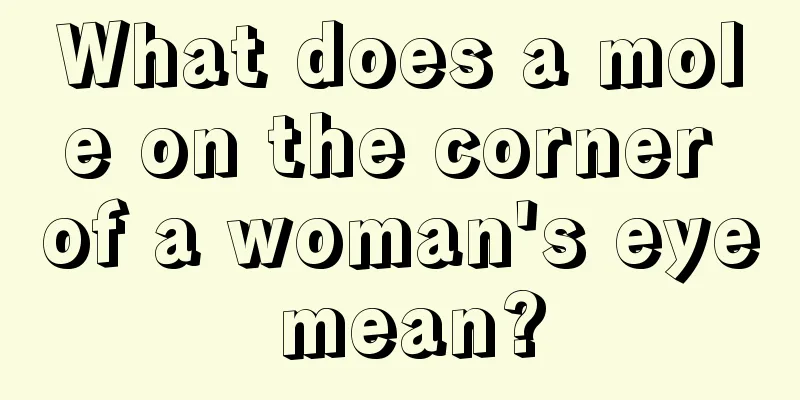What does a mole on the corner of a woman's eye mean?
