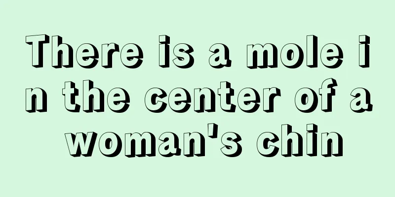 There is a mole in the center of a woman's chin