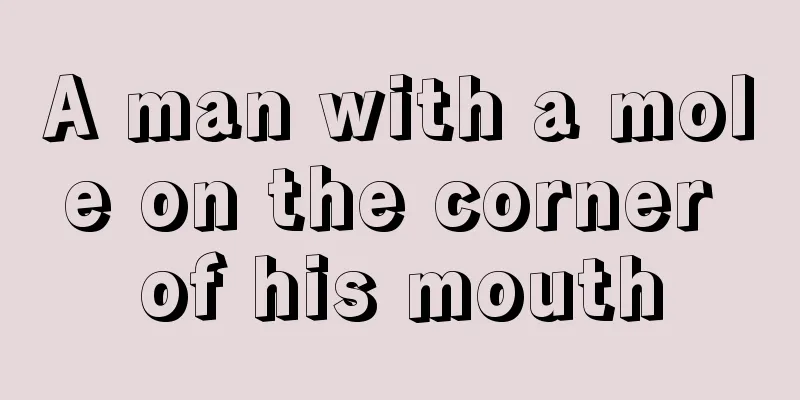 A man with a mole on the corner of his mouth