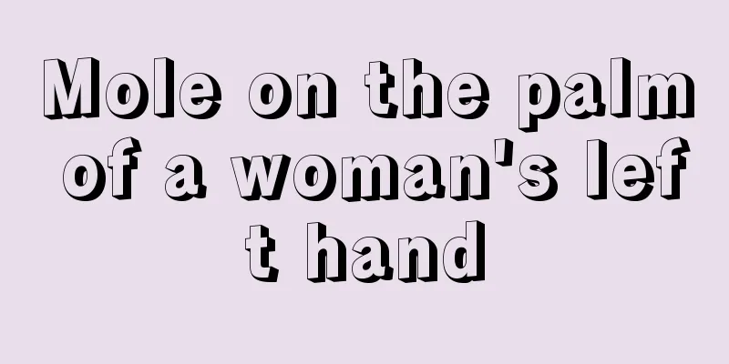Mole on the palm of a woman's left hand