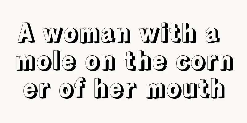 A woman with a mole on the corner of her mouth