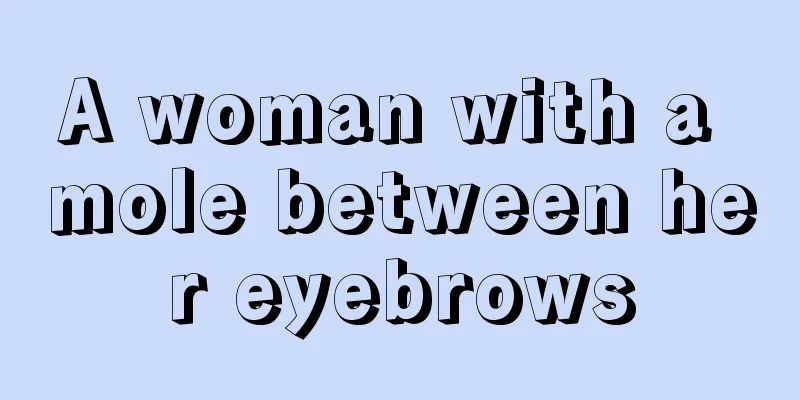 A woman with a mole between her eyebrows