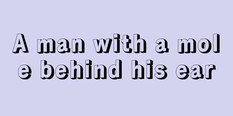 A man with a mole behind his ear