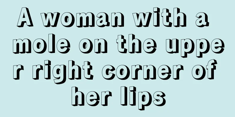 A woman with a mole on the upper right corner of her lips