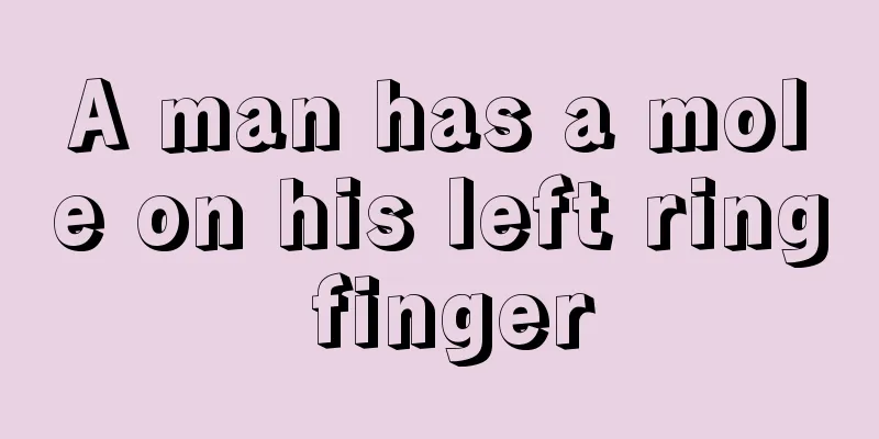 A man has a mole on his left ring finger
