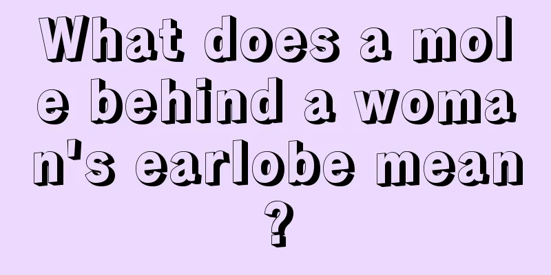 What does a mole behind a woman's earlobe mean?