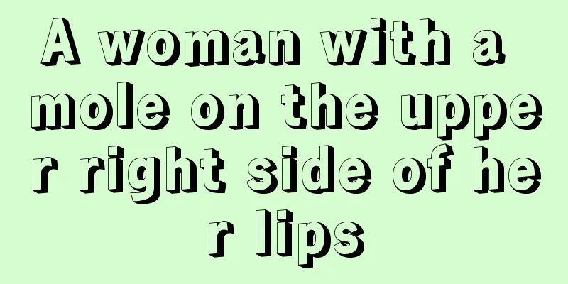 A woman with a mole on the upper right side of her lips
