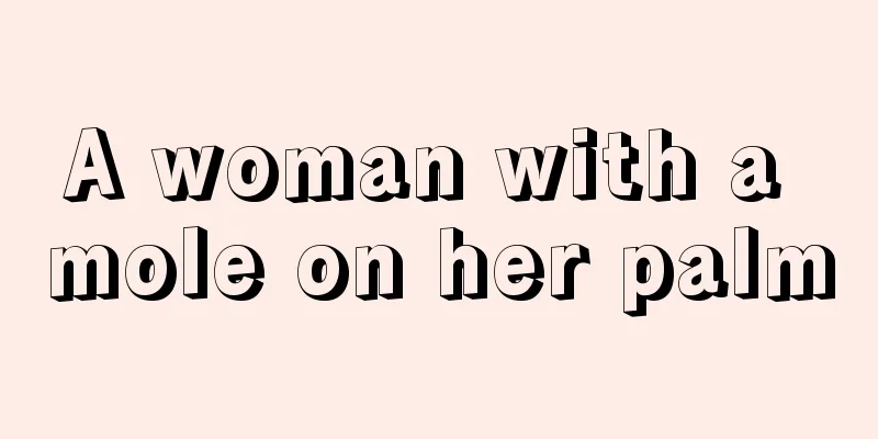 A woman with a mole on her palm