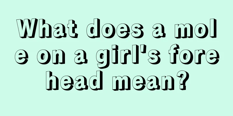 What does a mole on a girl's forehead mean?