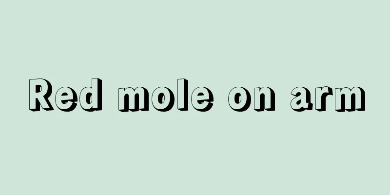 Red mole on arm