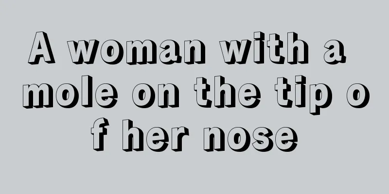 A woman with a mole on the tip of her nose