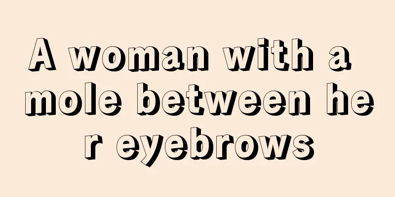 A woman with a mole between her eyebrows