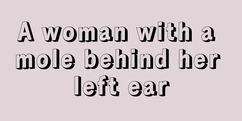 A woman with a mole behind her left ear