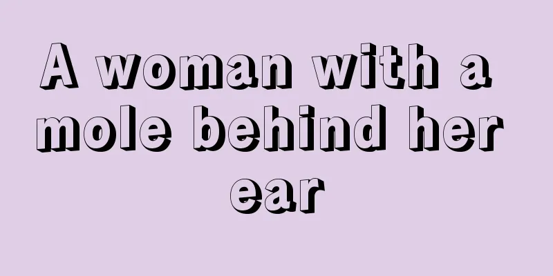 A woman with a mole behind her ear