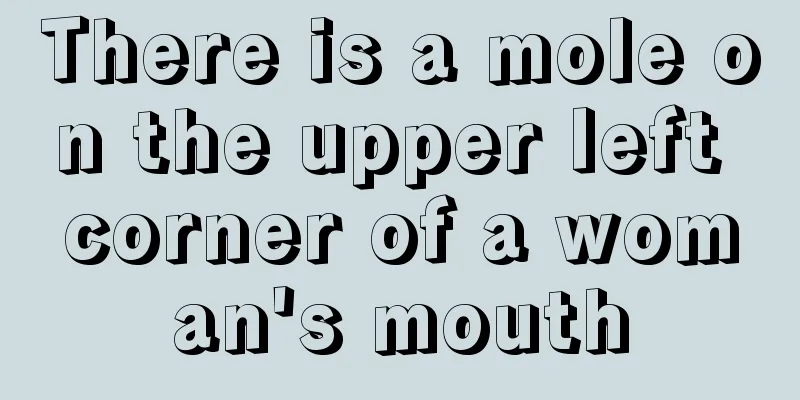 There is a mole on the upper left corner of a woman's mouth