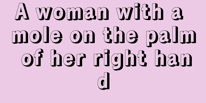 A woman with a mole on the palm of her right hand