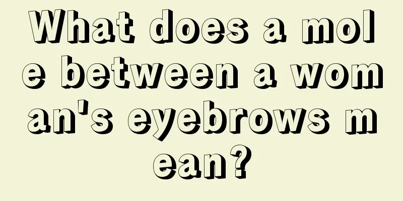 What does a mole between a woman's eyebrows mean?