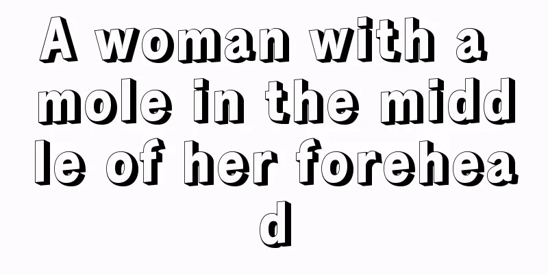 A woman with a mole in the middle of her forehead