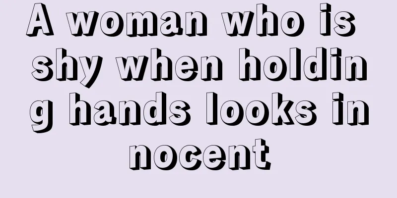 A woman who is shy when holding hands looks innocent